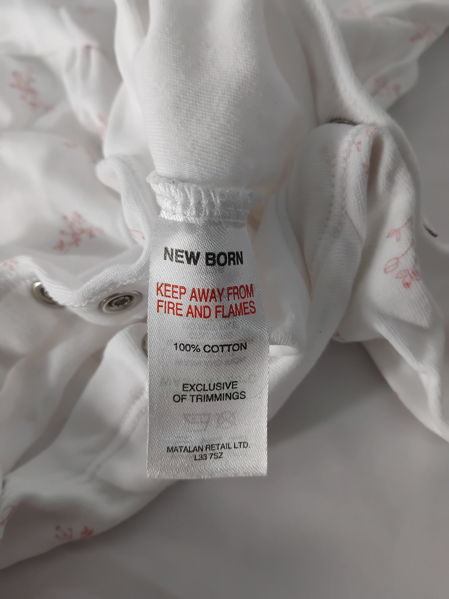 Babies (new born) White babygrow with pink flowers and collar