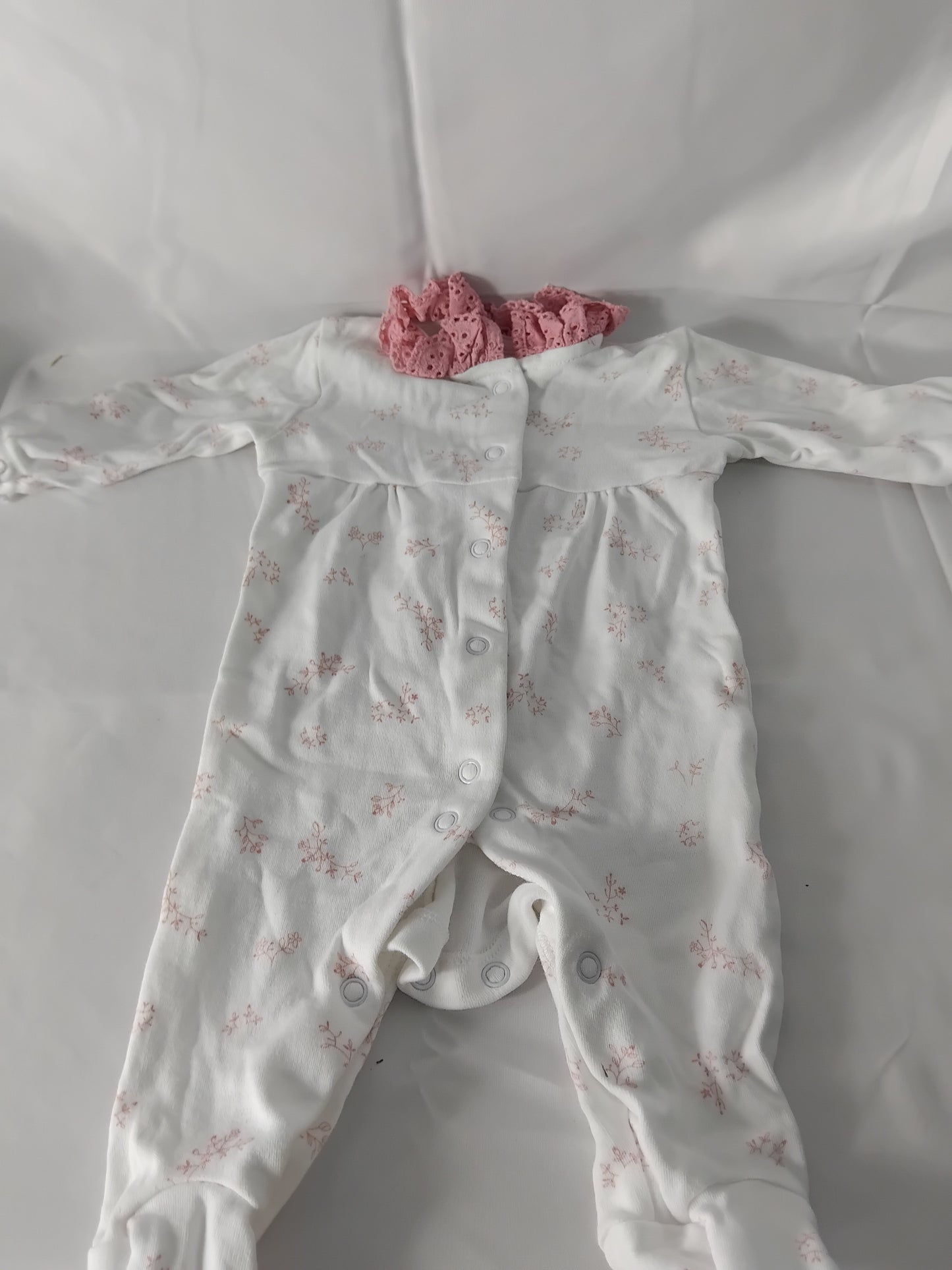 Babies (new born) White babygrow with pink flowers and collar